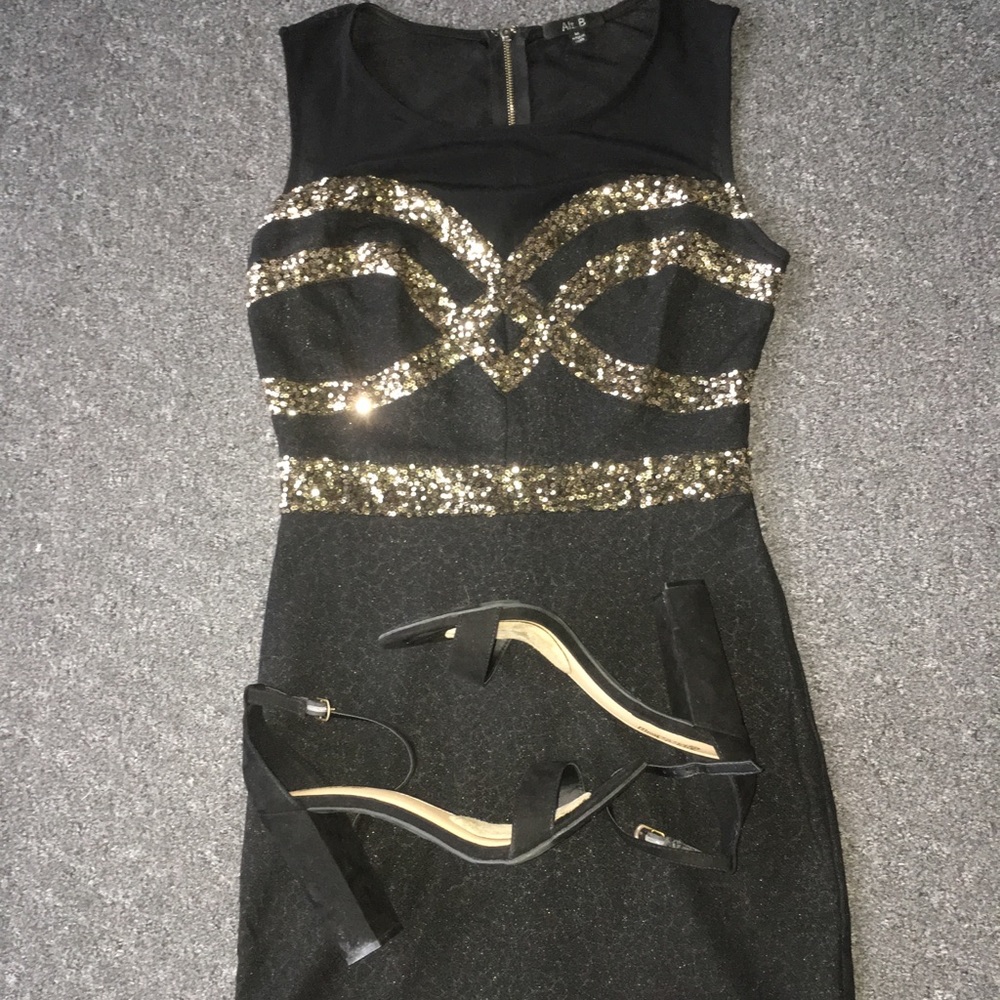 Black and gold sequined mini dress with mesh top